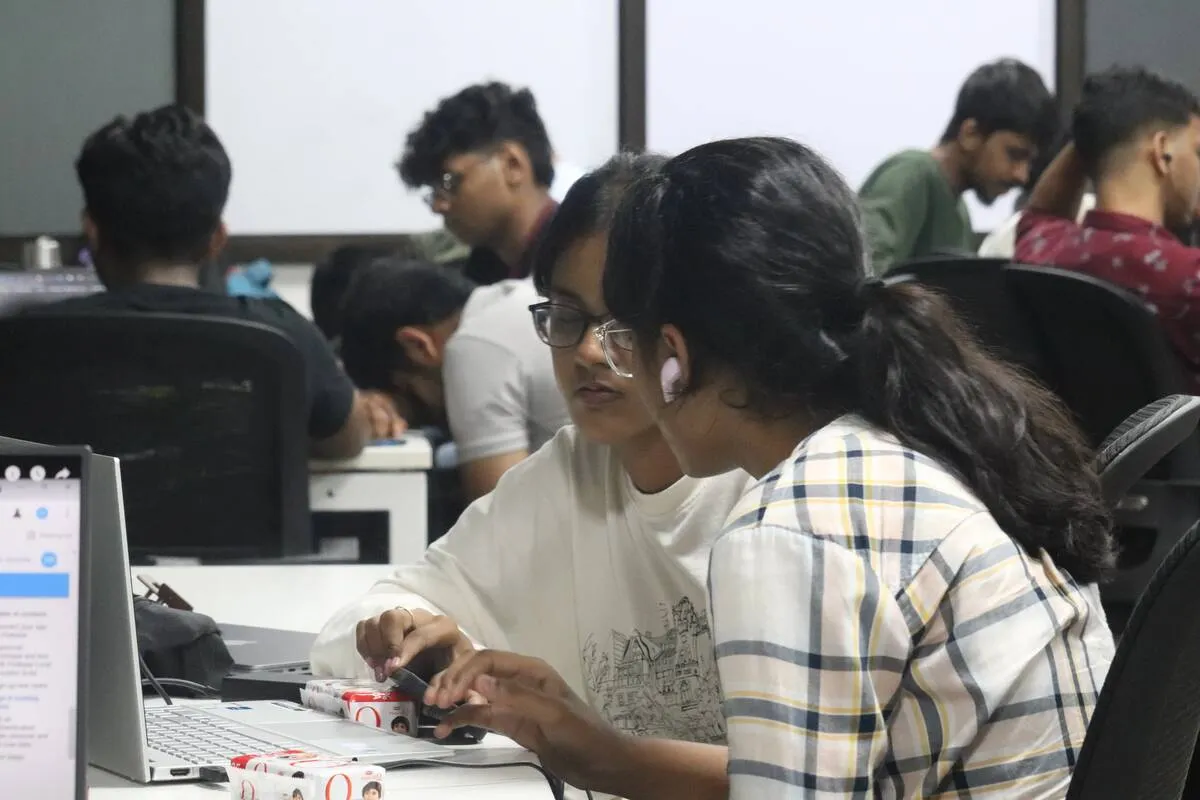 Participants working on laptops